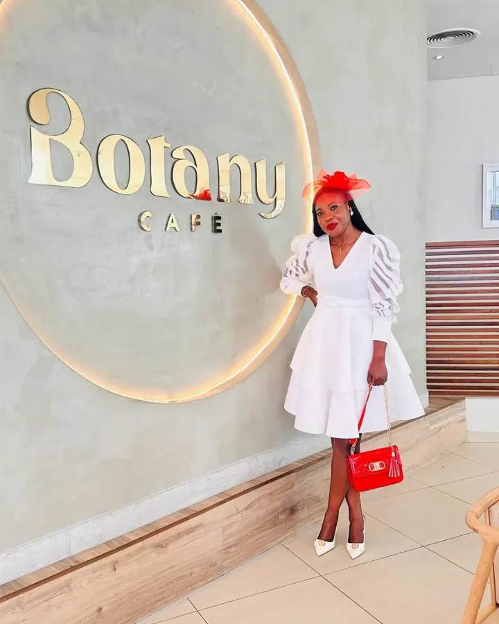 Colette in a white dress at Botany Café