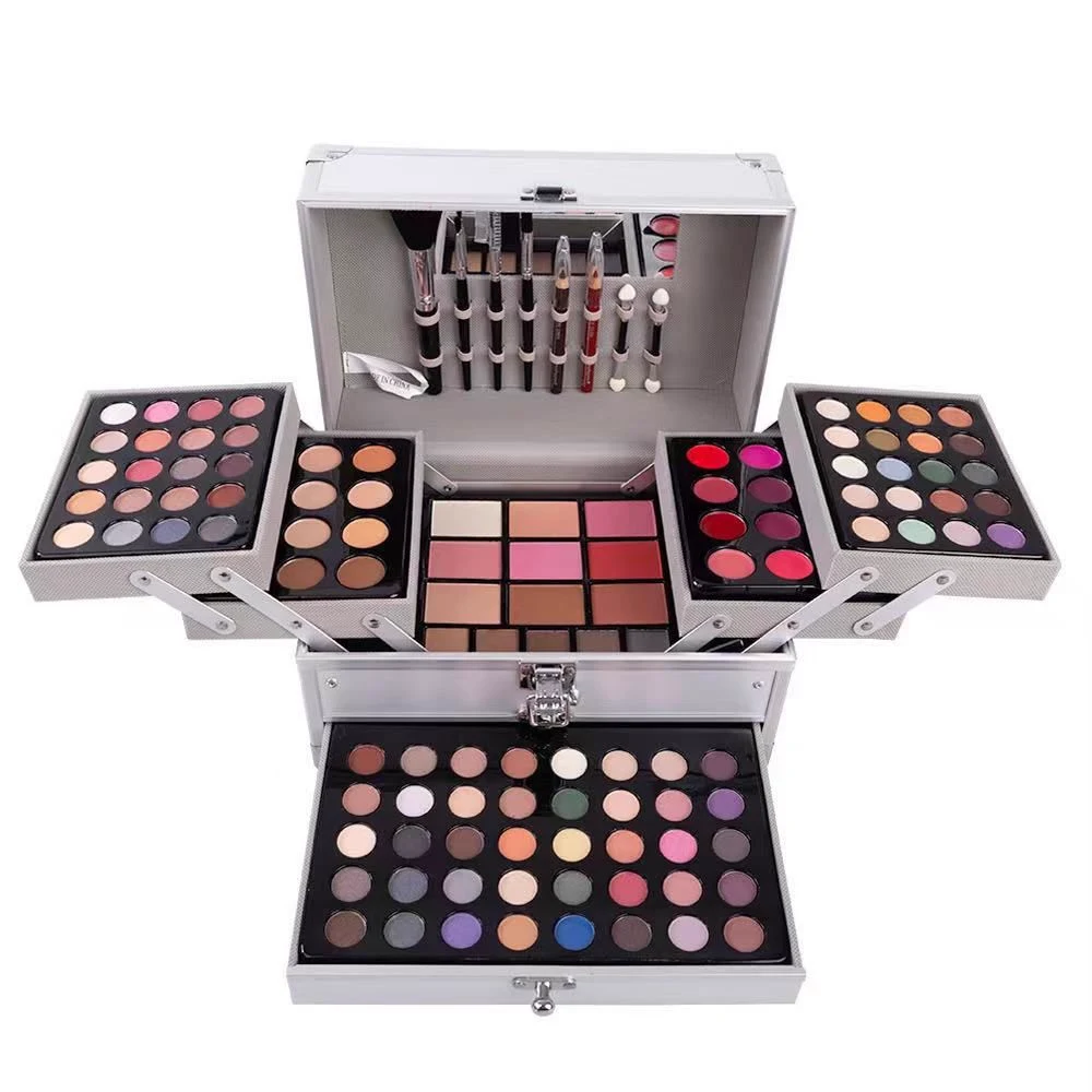 Large silver makeup case with fold-out trays, a drawer of eyeshadows and brushes